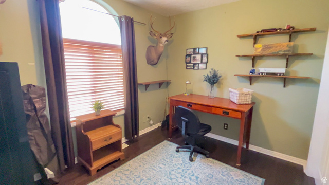 1797 Sunset Road Enoch, UT 84721 - Photo 33 of 80 Arched window with wood-finish blinds, flanked by drapes