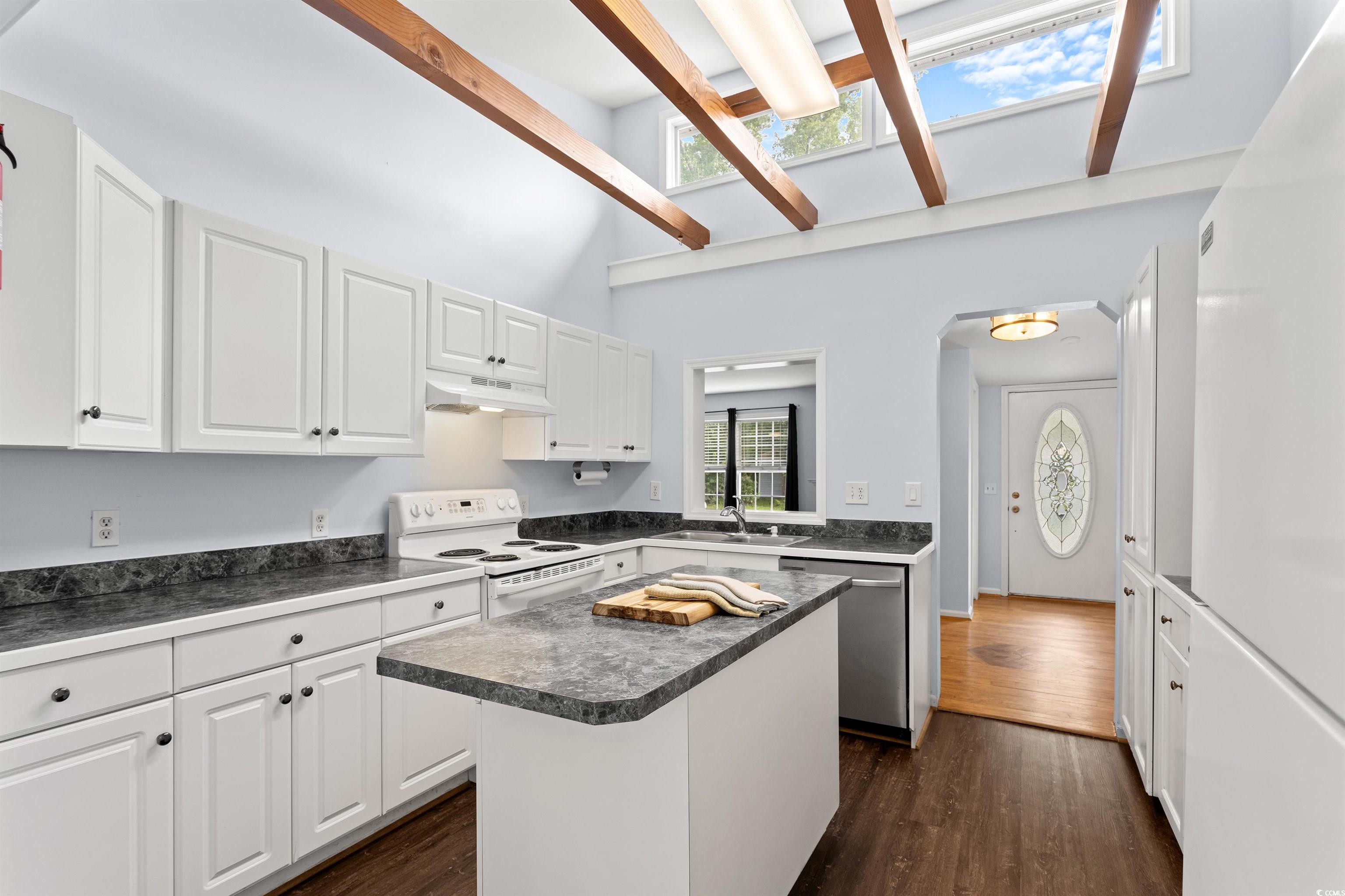 949 Derrick Lane Murrells Inlet, SC 29576 - Photo 14 of 40 Kitchen featuring white cabinetry, a center island