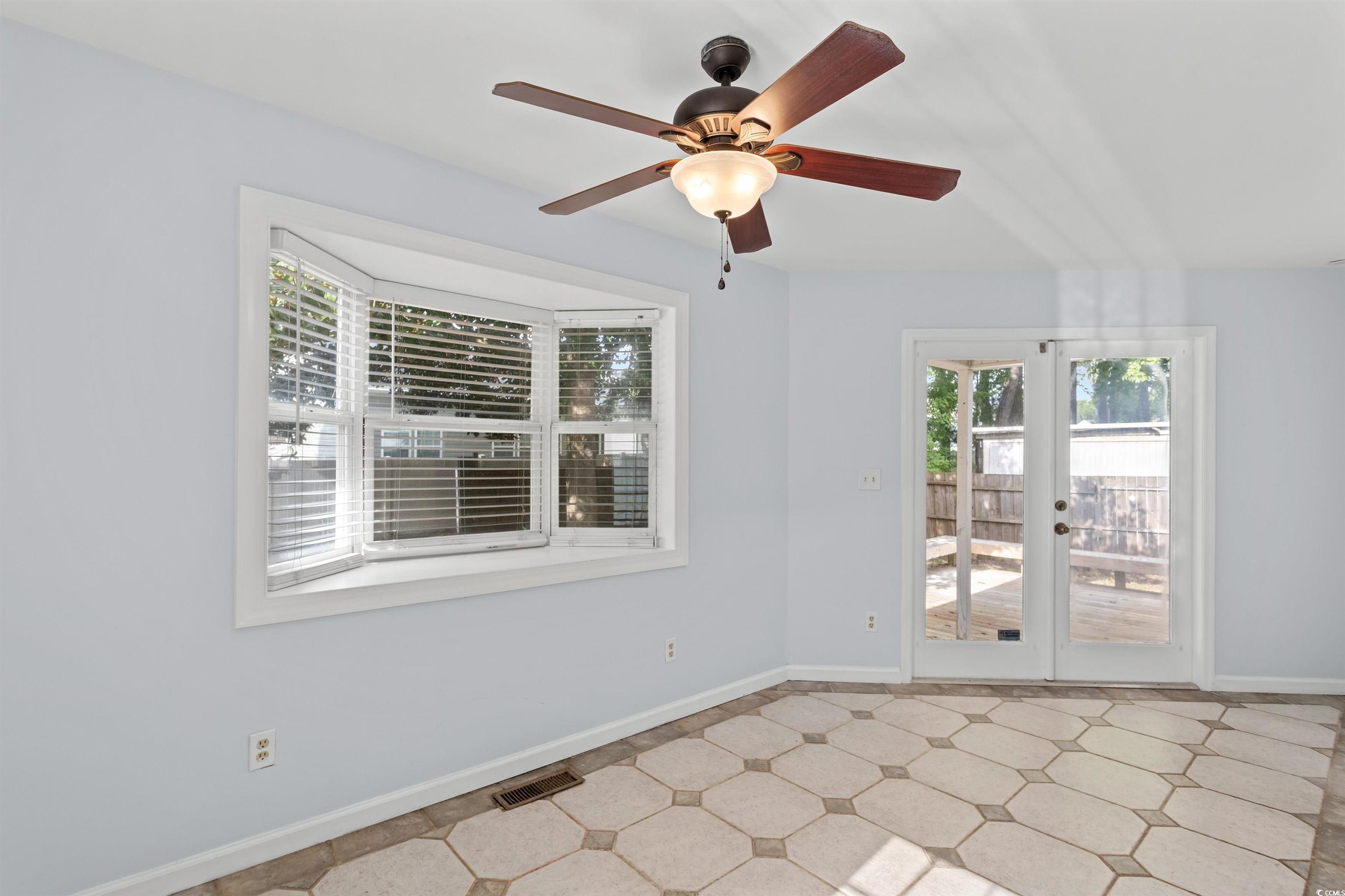 949 Derrick Lane Murrells Inlet, SC 29576 - Photo 15 of 40 Tiled spare room with french doors and ceiling fan