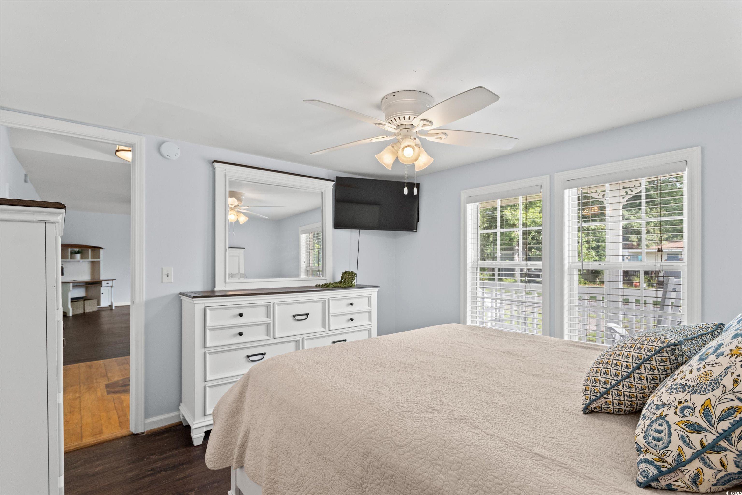 949 Derrick Lane Murrells Inlet, SC 29576 - Photo 19 of 40 Bedroom with ceiling fan and dark hardwood / wood-