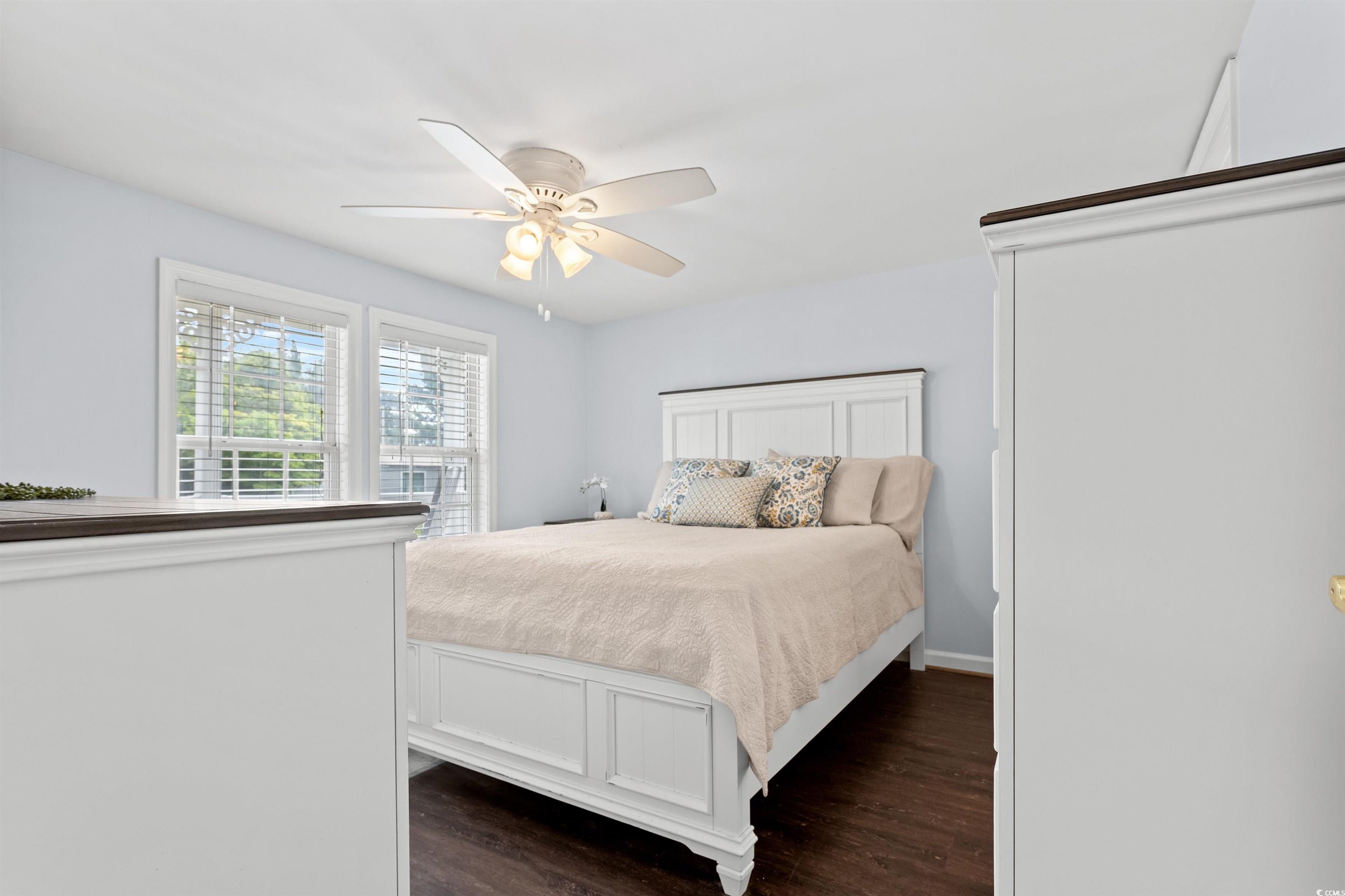949 Derrick Lane Murrells Inlet, SC 29576 - Photo 20 of 40 Bedroom with dark hardwood / wood-style flooring a