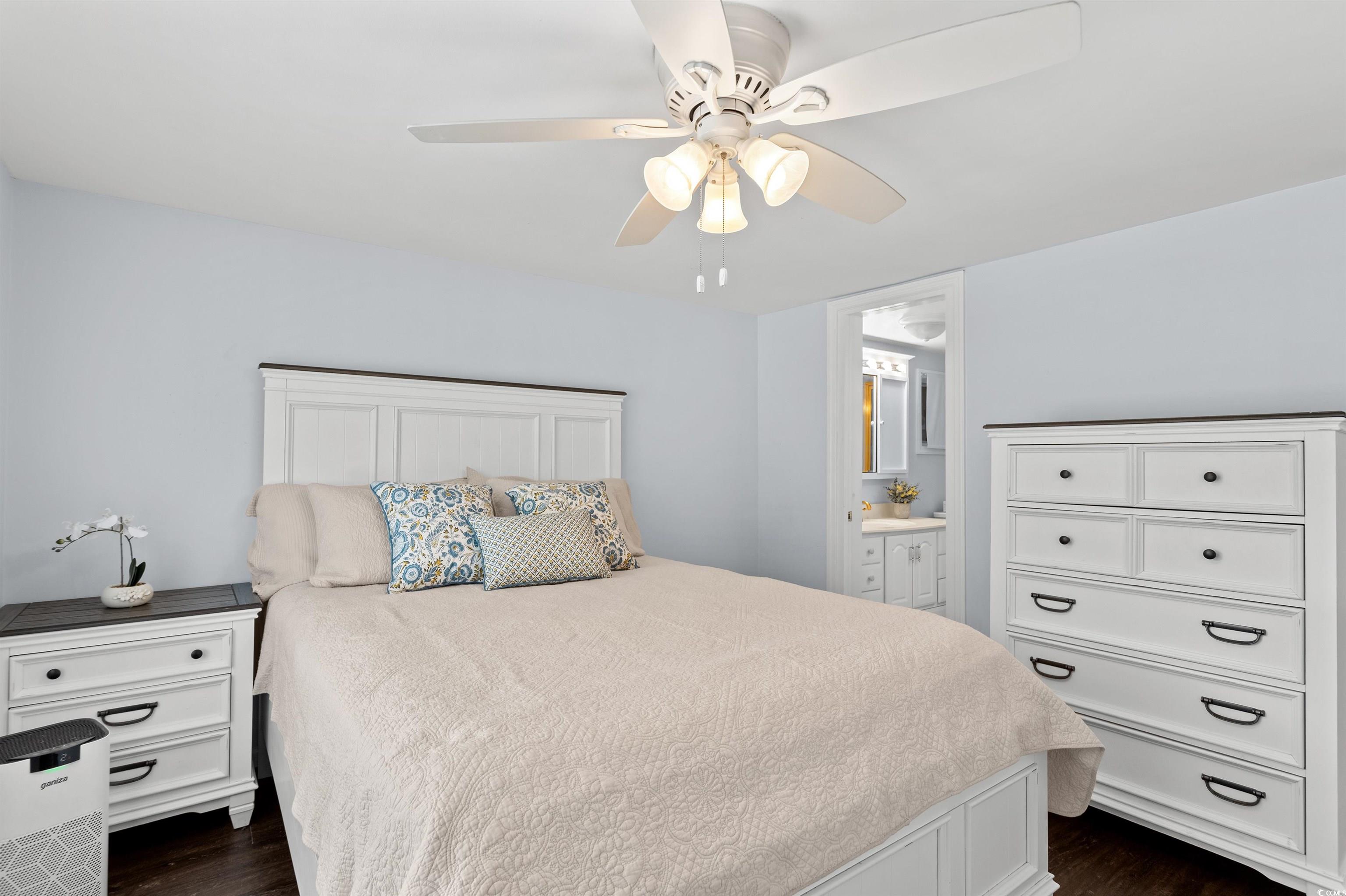 949 Derrick Lane Murrells Inlet, SC 29576 - Photo 21 of 40 Bedroom with connected bathroom, dark hardwood / w