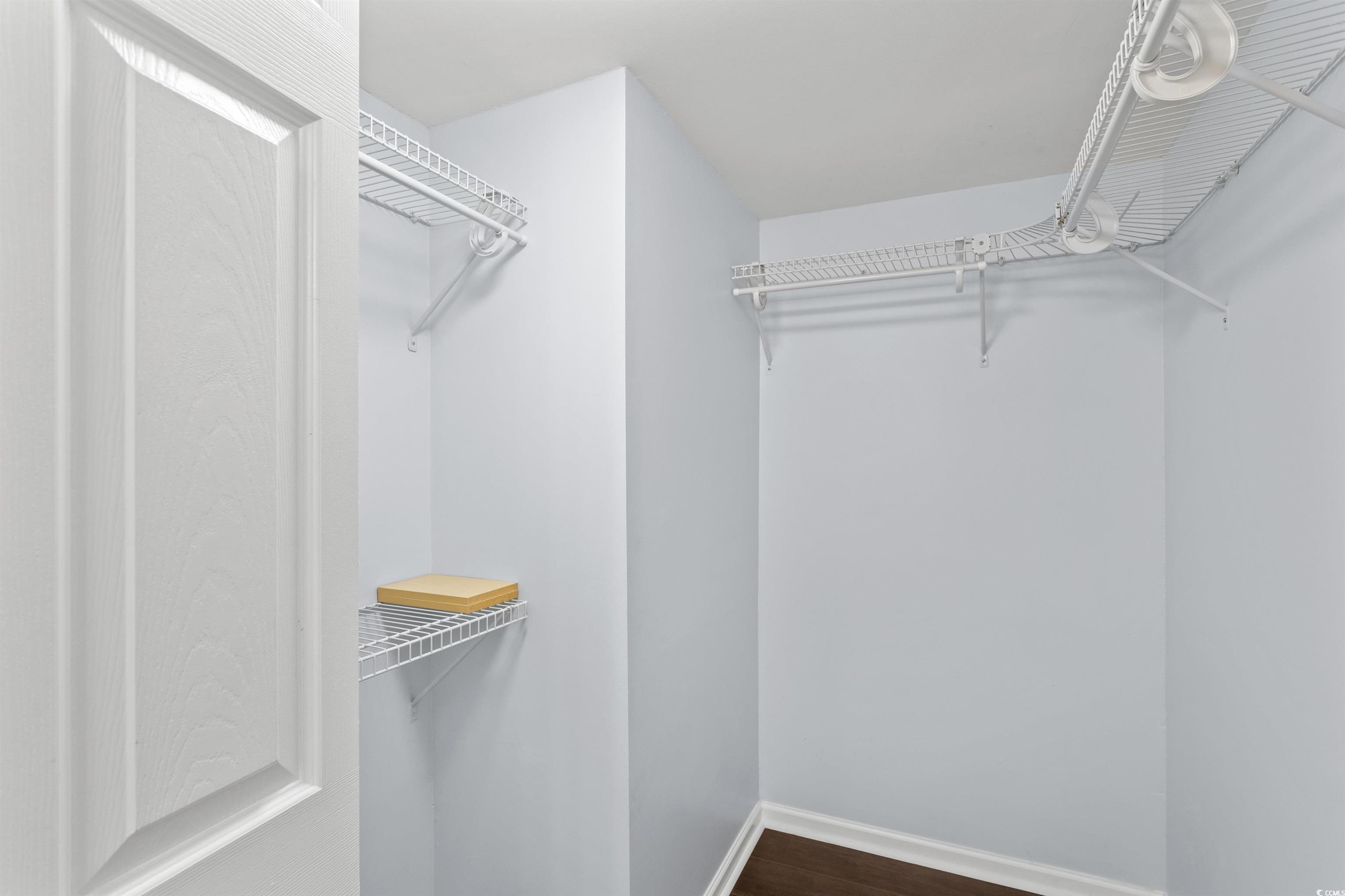 949 Derrick Lane Murrells Inlet, SC 29576 - Photo 26 of 40 Walk in closet featuring hardwood / wood-style flo