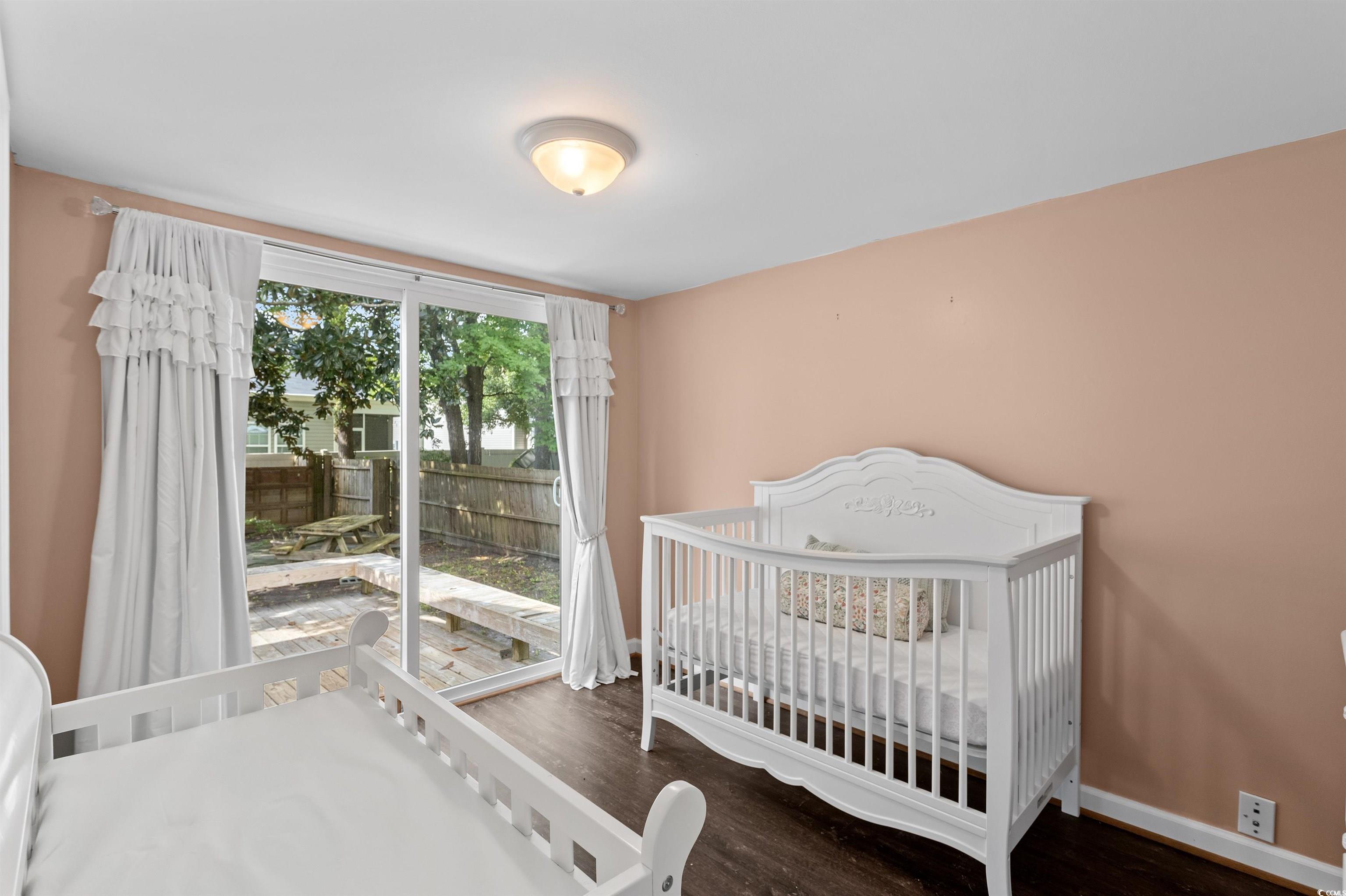 949 Derrick Lane Murrells Inlet, SC 29576 - Photo 28 of 40 Bedroom featuring a nursery area and hardwood / wo