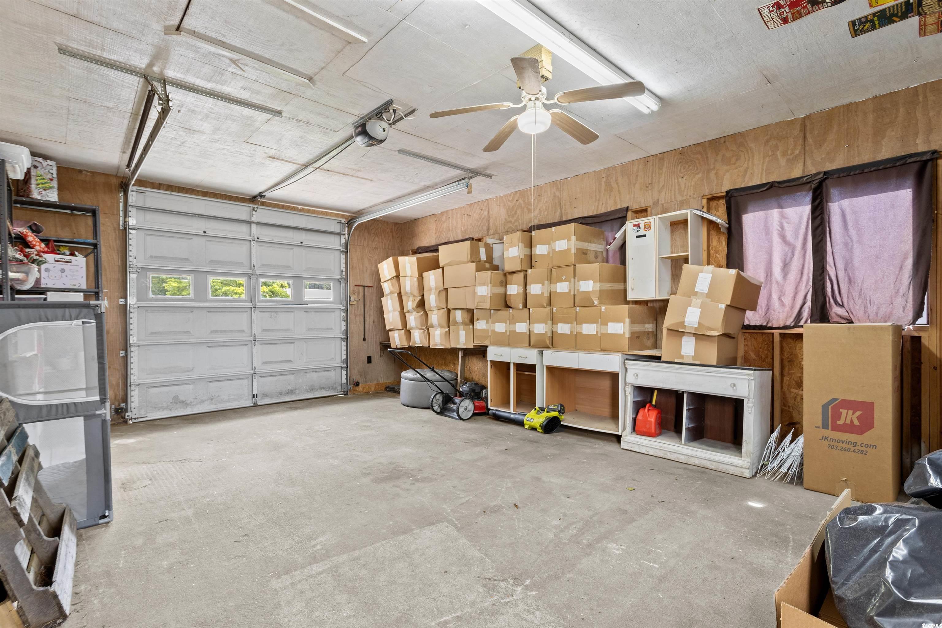 949 Derrick Lane Murrells Inlet, SC 29576 - Photo 32 of 40 Garage featuring ceiling fan