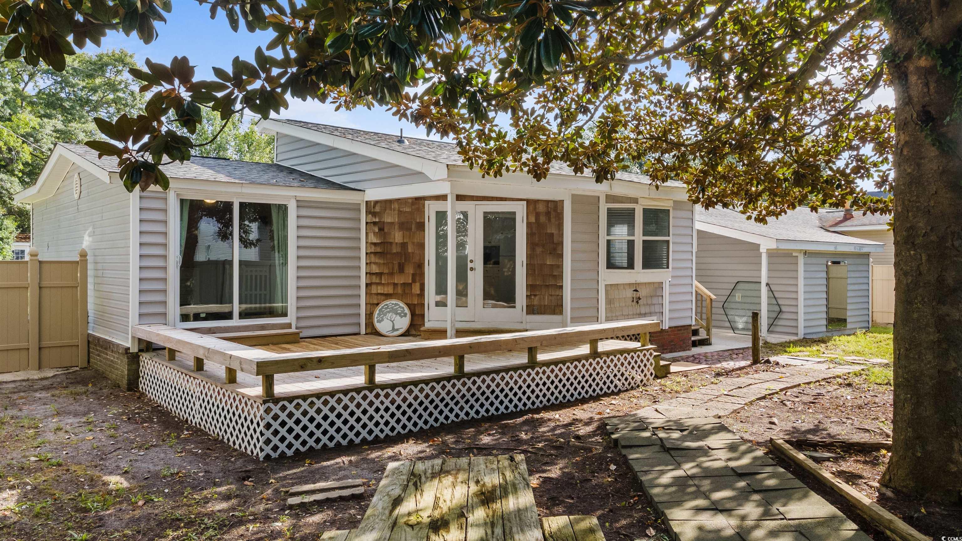 949 Derrick Lane Murrells Inlet, SC 29576 - Photo 35 of 40 Back of property with a wooden deck and french doo