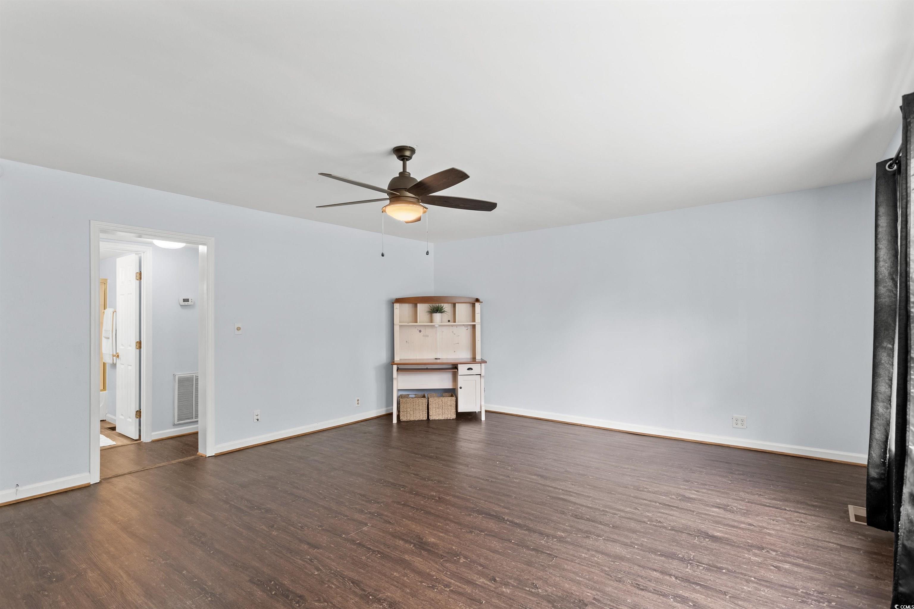 949 Derrick Lane Murrells Inlet, SC 29576 - Photo 9 of 40 Interior space with ceiling fan and dark hardwood