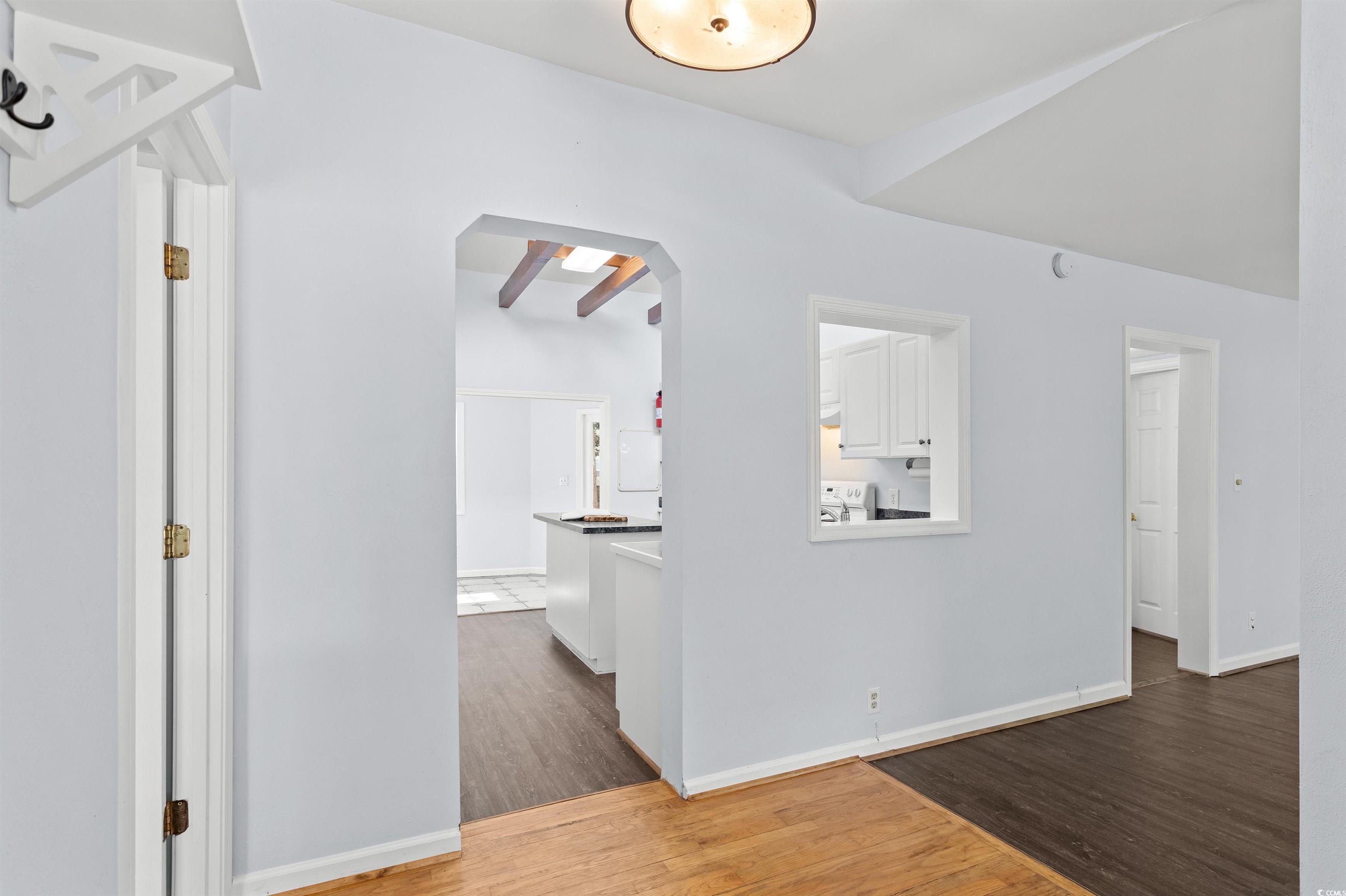 949 Derrick Lane Murrells Inlet, SC 29576 - Photo 10 of 40 Hallway featuring beamed ceiling and hardwood / wo