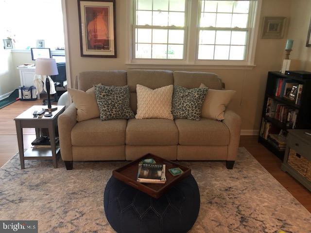 624 Southern Hills Drive, Unit B2A Arnold, MD 21012 - Photo 5 of 13 a living room with furniture and a flat screen tv