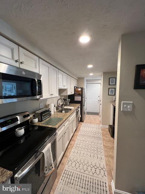 624 Southern Hills Drive, Unit B2A Arnold, MD 21012 - Photo 8 of 13 a large kitchen with stainless steel appliances granite countertop a sink stove and refrigerator