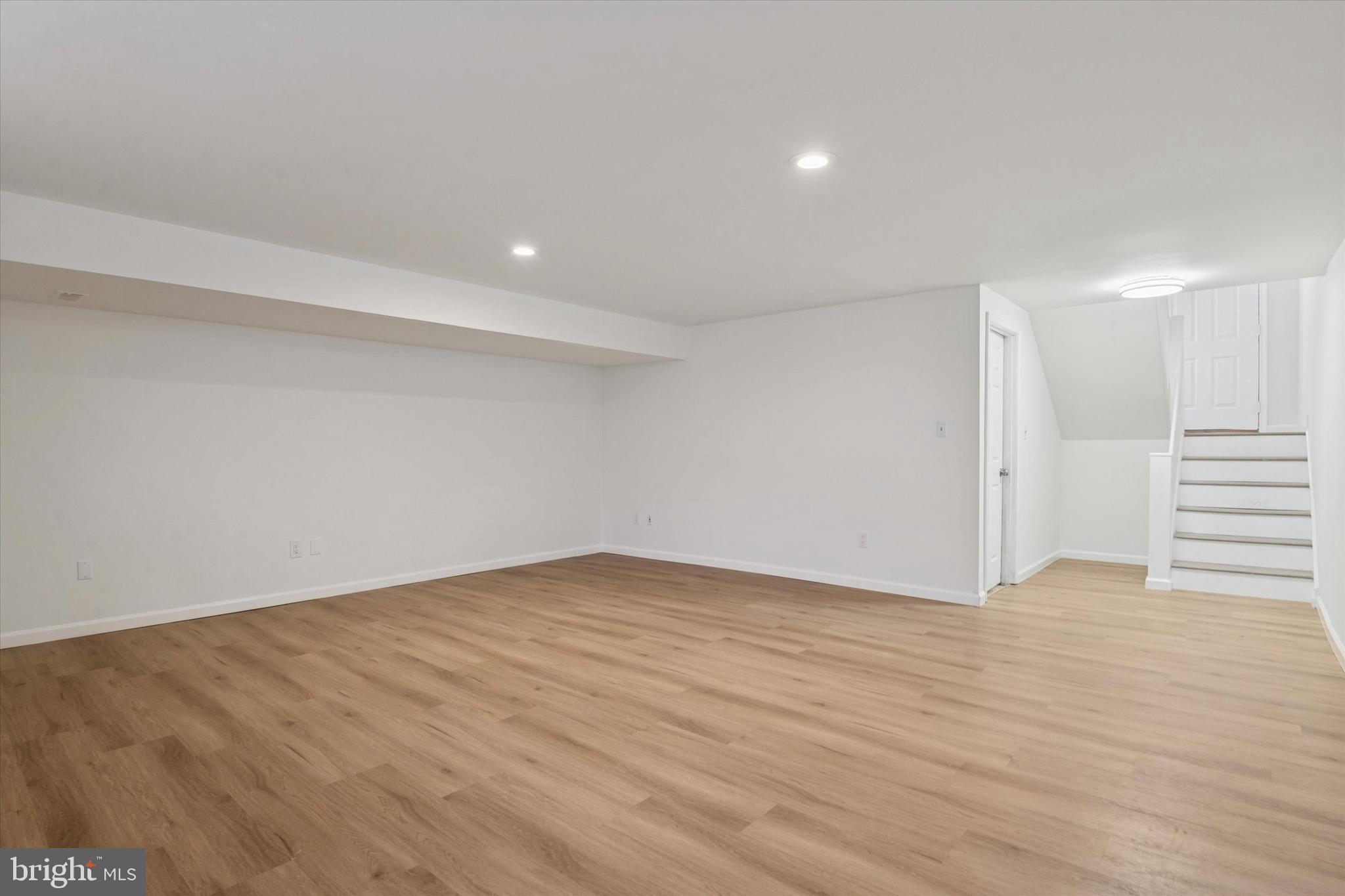 110 Hawk Drive Newark, DE 19702 - Photo 12 of 25 a view of an empty room with wooden floor