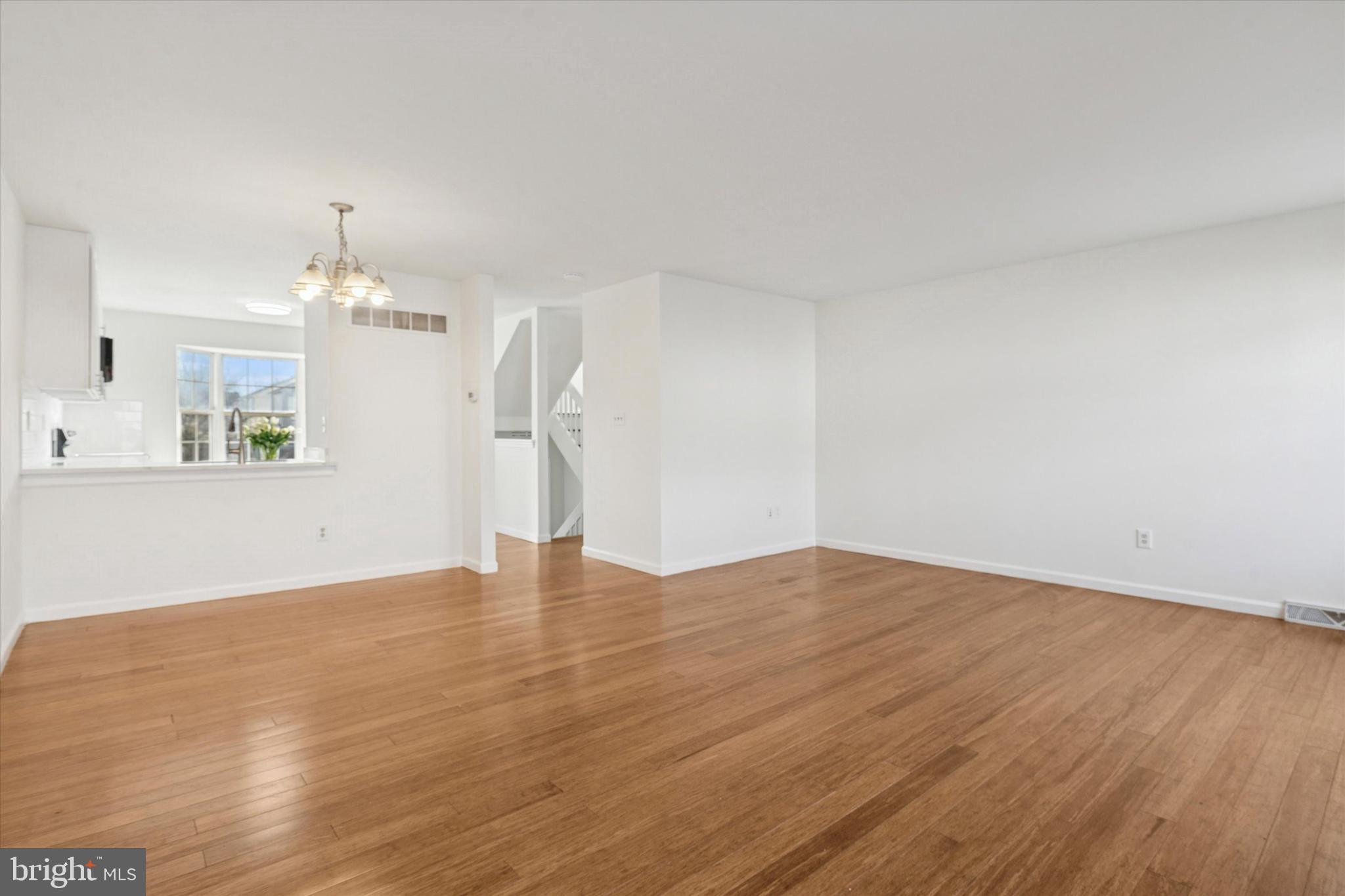 110 Hawk Drive Newark, DE 19702 - Photo 14 of 25 a view of empty room with wooden floor and window