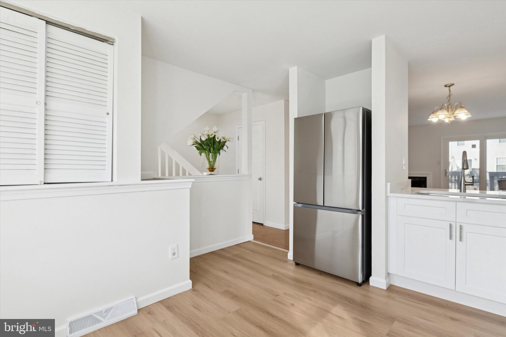 110 Hawk Drive Newark, DE 19702 - Photo 18 of 25 a kitchen with a refrigerator a microwave and sink