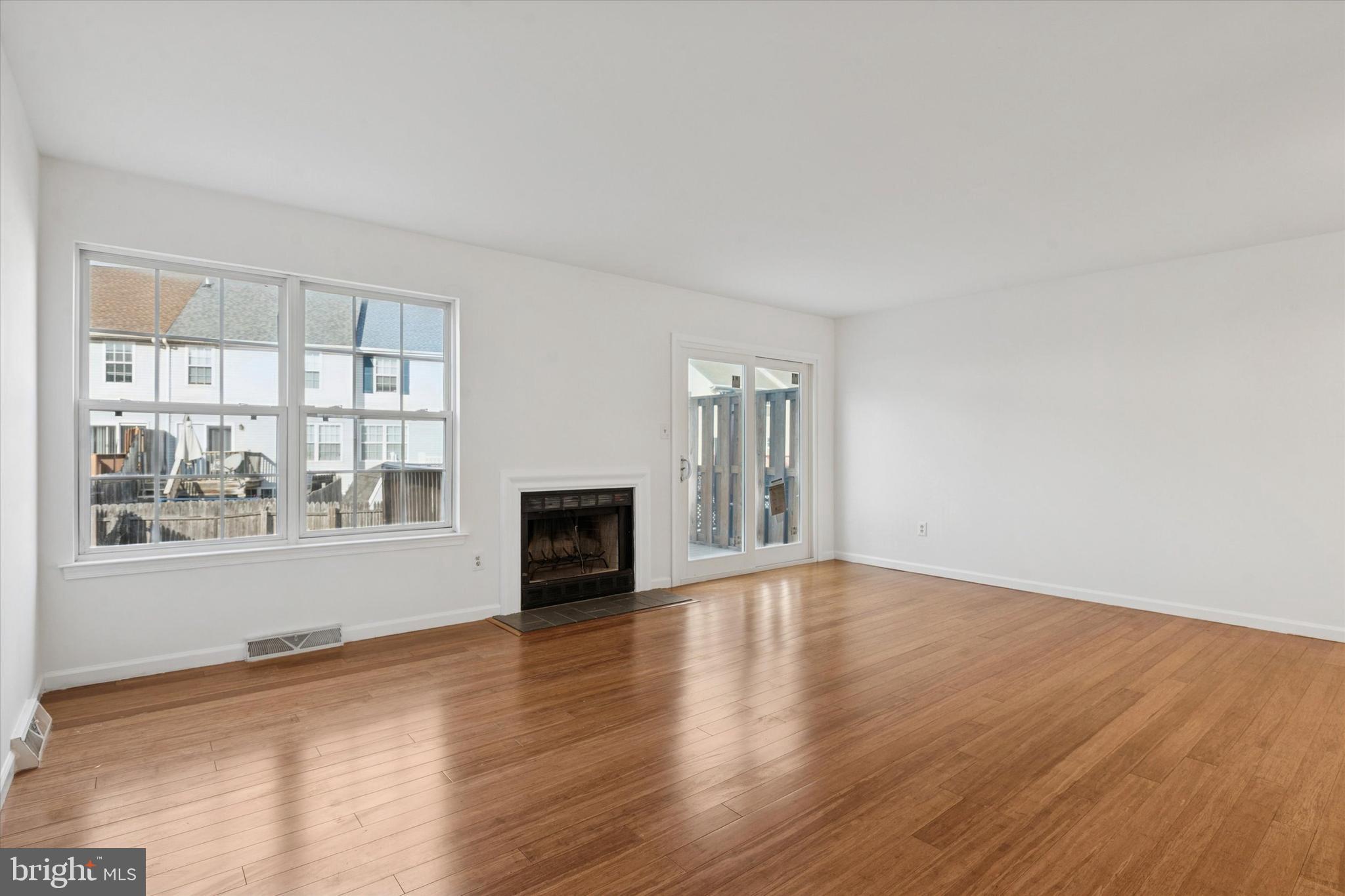 110 Hawk Drive Newark, DE 19702 - Photo 2 of 25 a view of empty room with wooden floor and fan