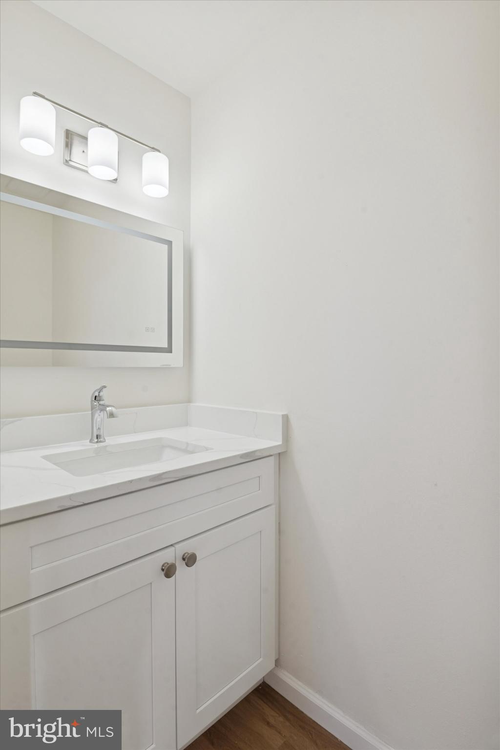 110 Hawk Drive Newark, DE 19702 - Photo 22 of 25 a bathroom with a sink and a mirror