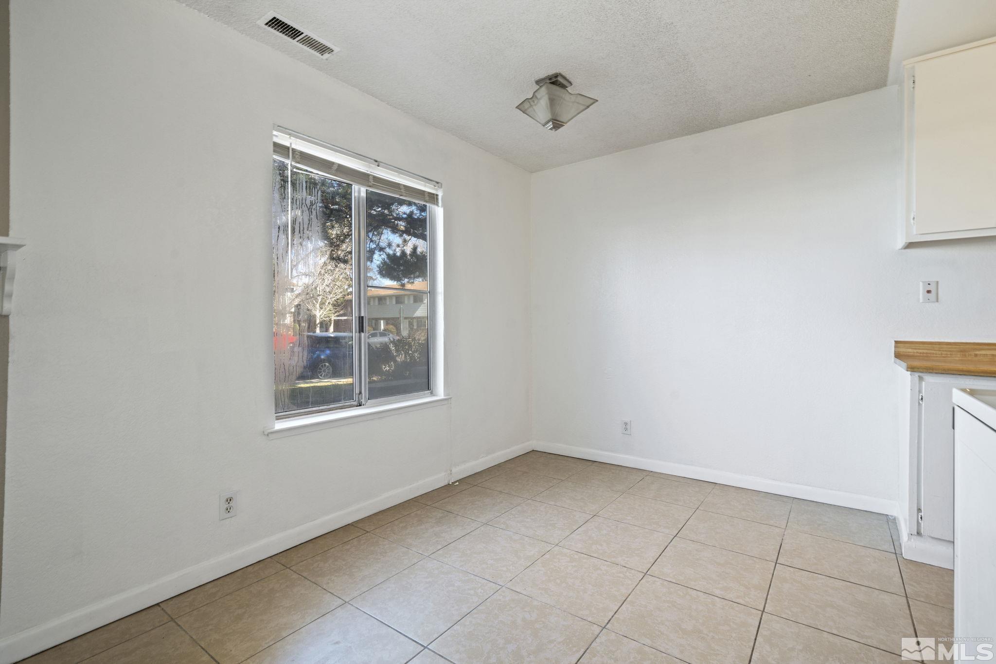 4606 Neil Road, Unit 193 Reno, NV 89502 - Photo 13 of 28 a view of an empty room with a window