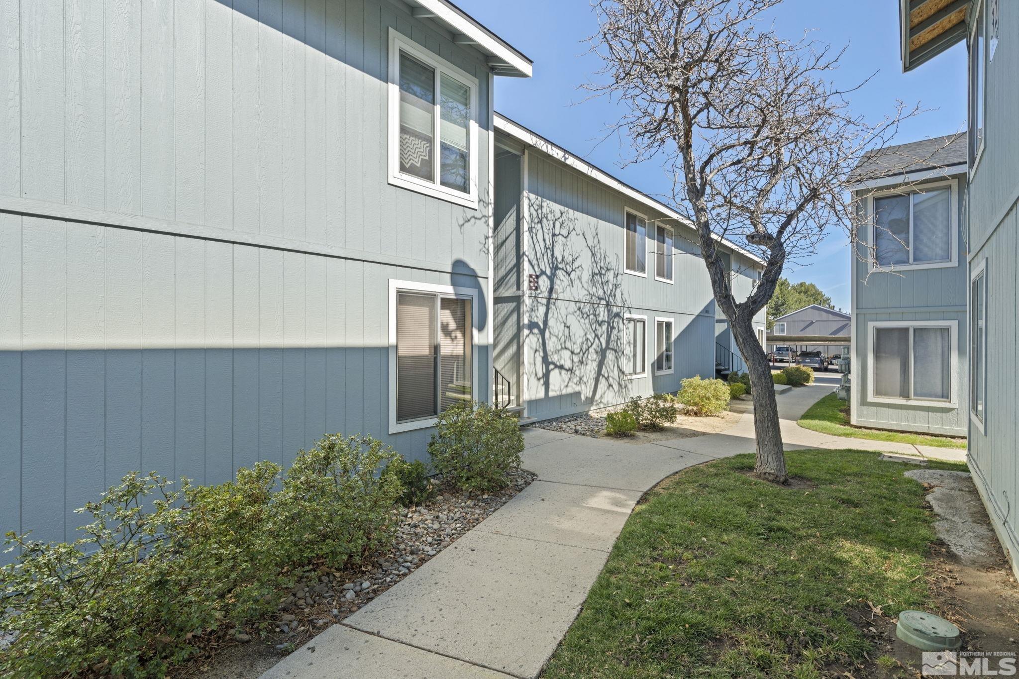 4606 Neil Road, Unit 193 Reno, NV 89502 - Photo 3 of 28 front view of a house with a yard