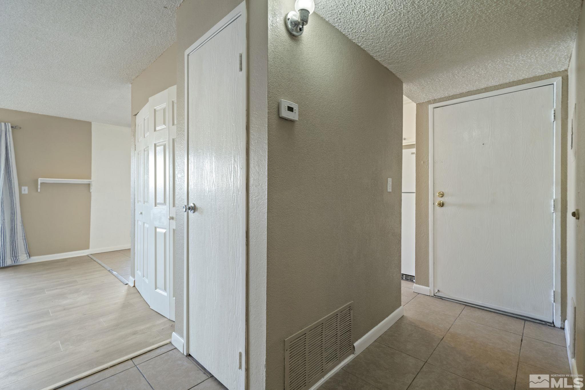 4606 Neil Road, Unit 193 Reno, NV 89502 - Photo 6 of 28 a view of an empty room with wooden floor