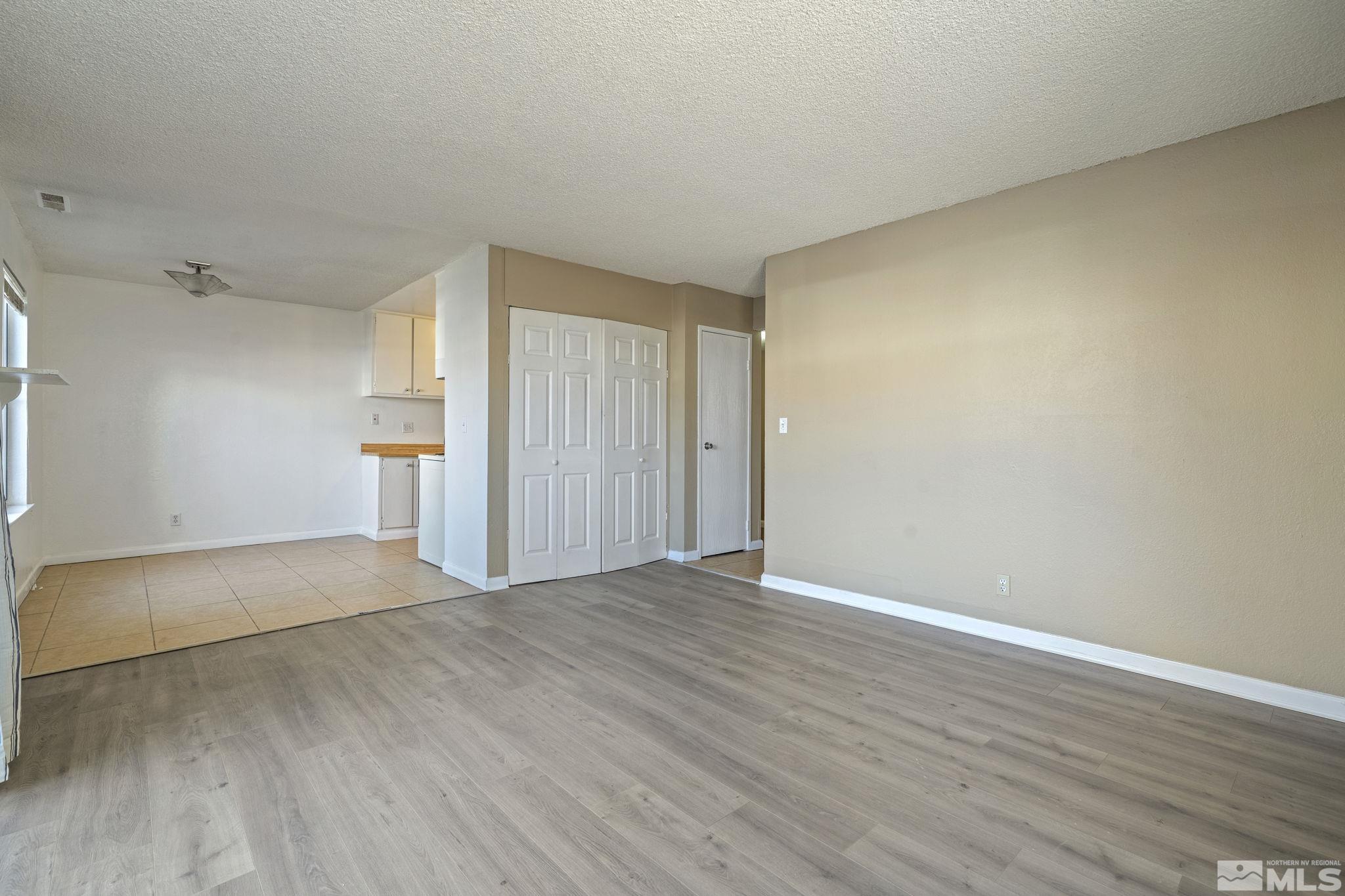 4606 Neil Road, Unit 193 Reno, NV 89502 - Photo 9 of 28 a view of empty room with wooden floor