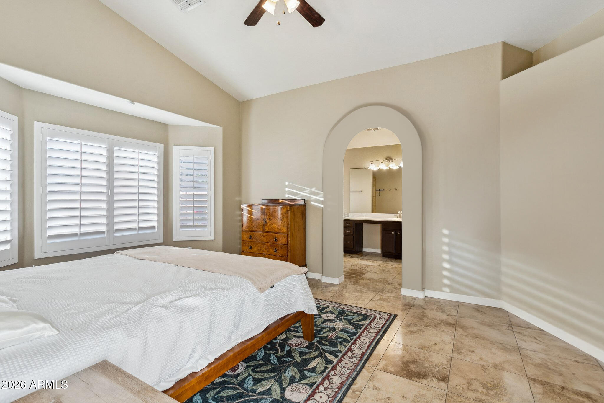 20238 North 9th Street Phoenix, AZ 85024 - Photo 15 of 38 a spacious bedroom with a large bed and a chandelier
