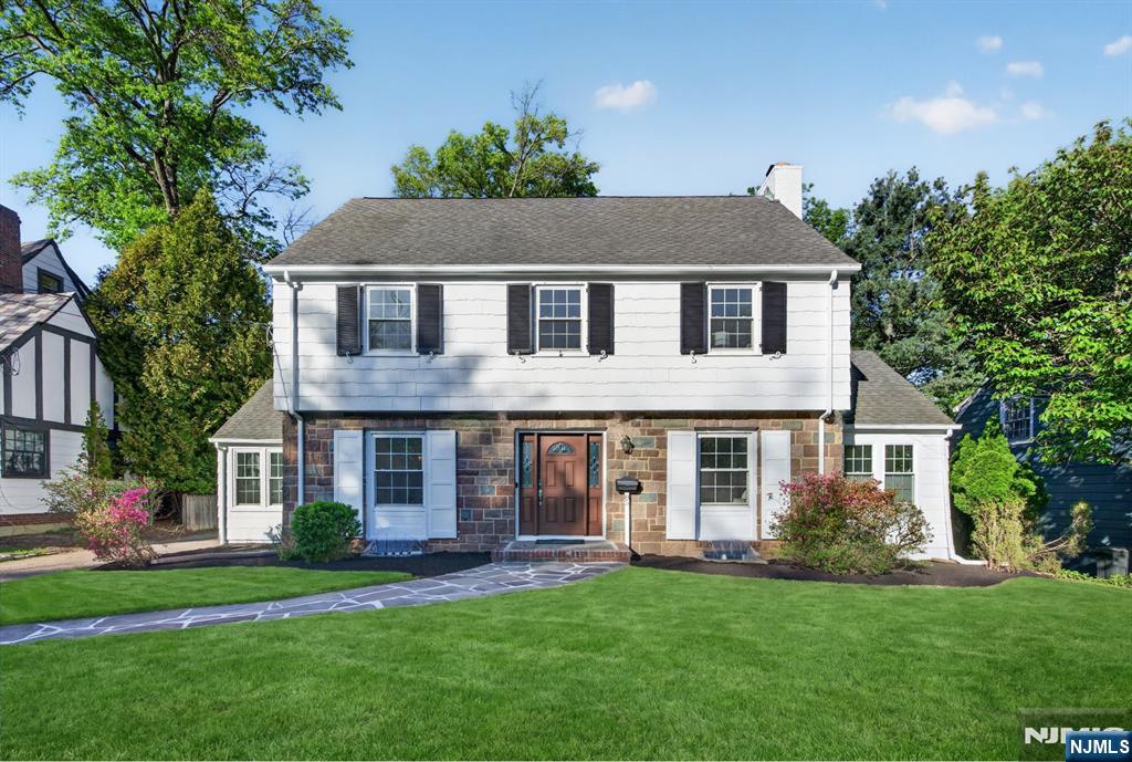 85 Whitney Road Short Hills, NJ 07078 - Photo 1 of 34 front view of a house with a yard