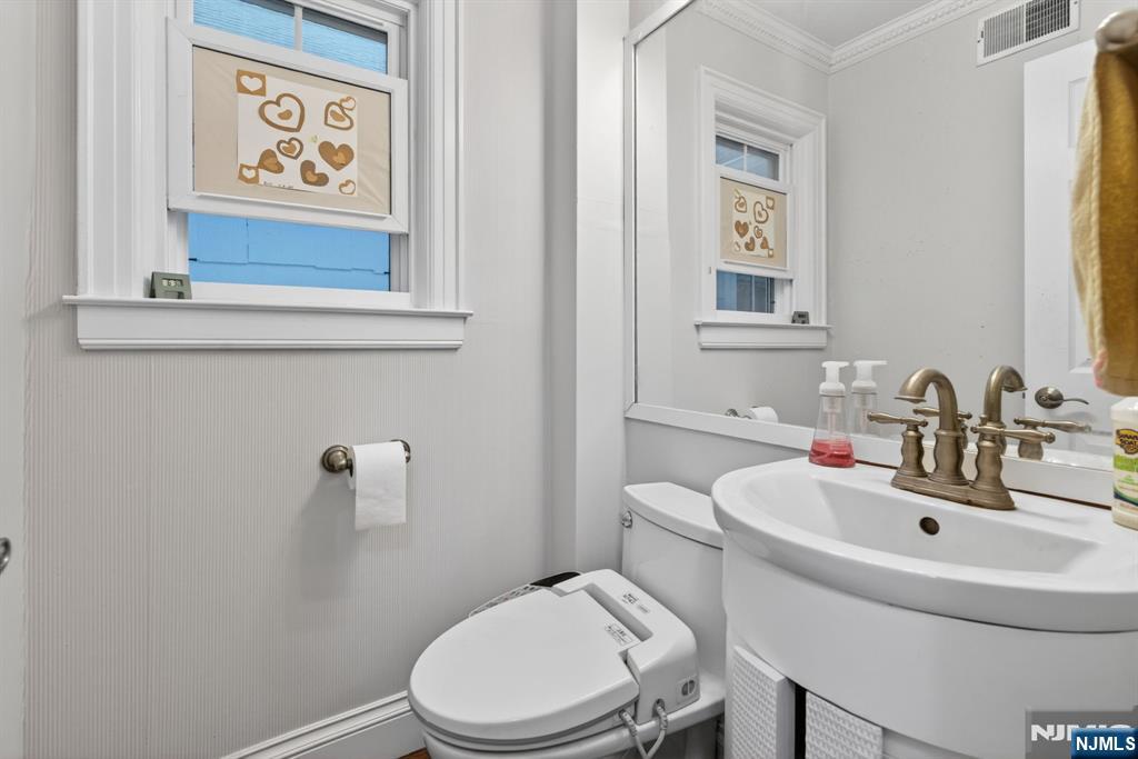85 Whitney Road Short Hills, NJ 07078 - Photo 14 of 34 a bathroom with a toilet and sink