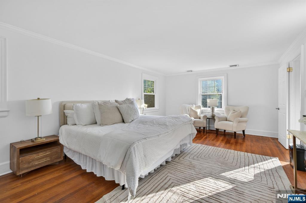 85 Whitney Road Short Hills, NJ 07078 - Photo 16 of 34 a bed room with a bed and a chair