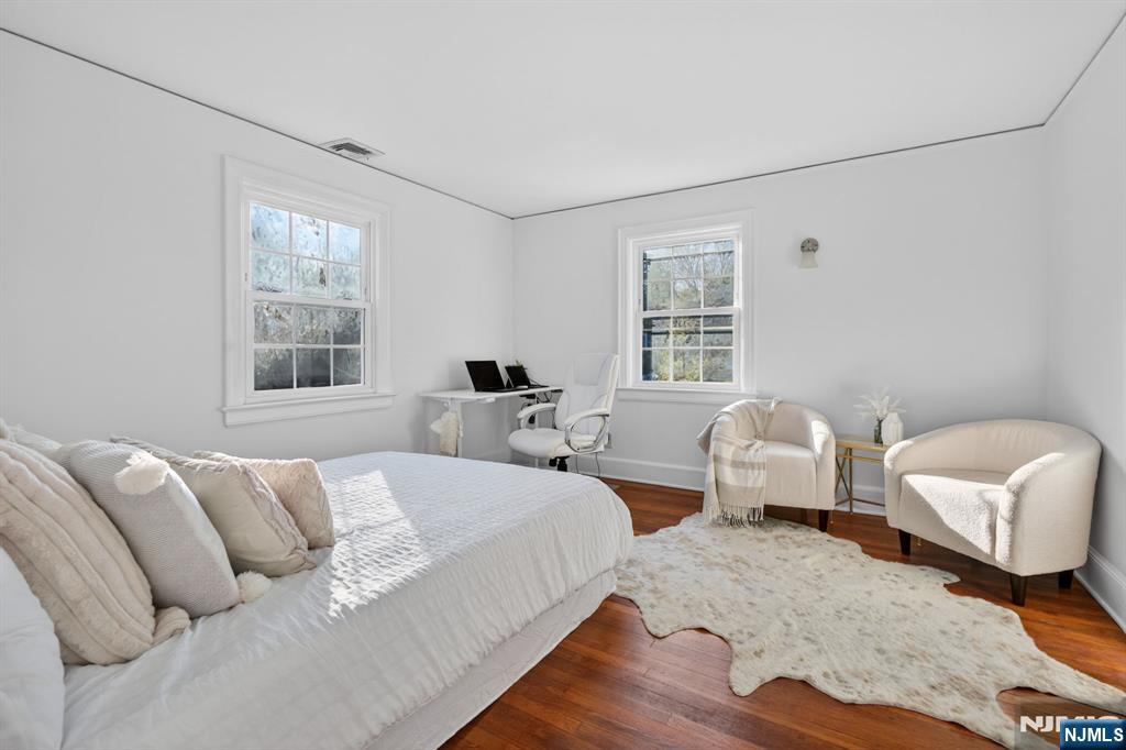 85 Whitney Road Short Hills, NJ 07078 - Photo 18 of 34 a bedroom with two beds and a window