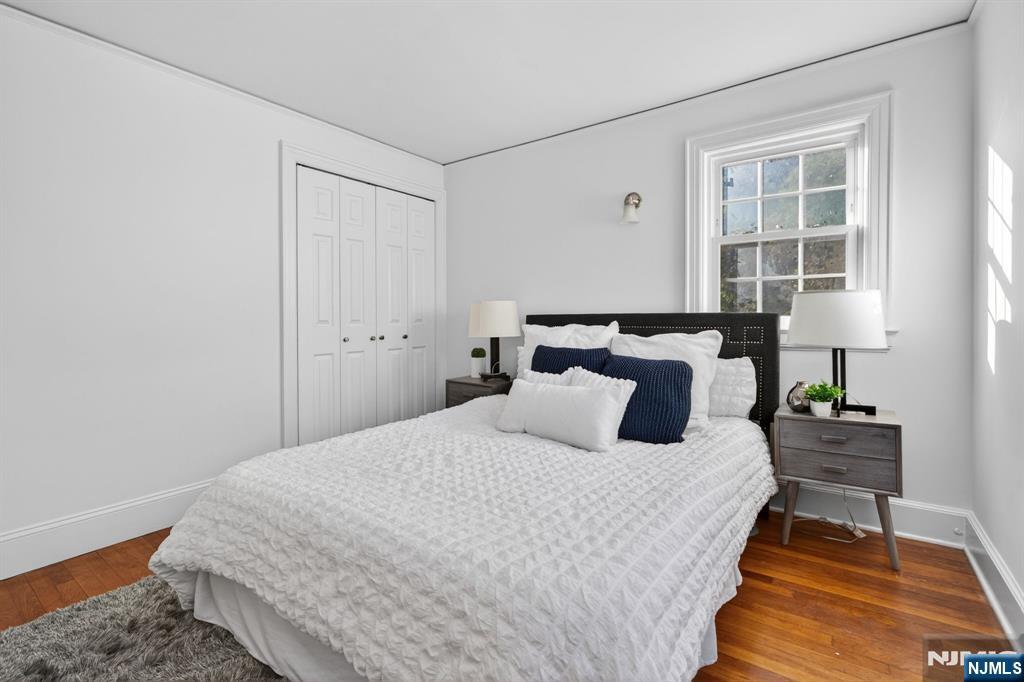 85 Whitney Road Short Hills, NJ 07078 - Photo 21 of 34 a bedroom with a bed and wooden floor