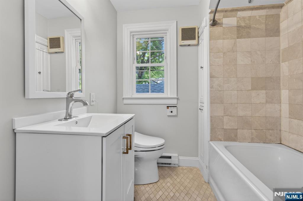 85 Whitney Road Short Hills, NJ 07078 - Photo 22 of 34 a bathroom with a sink toilet and bathtub
