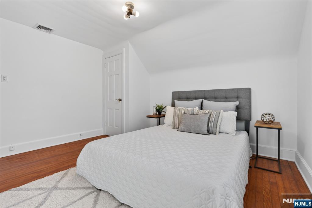 85 Whitney Road Short Hills, NJ 07078 - Photo 24 of 34 a bedroom with a bed and a lamp