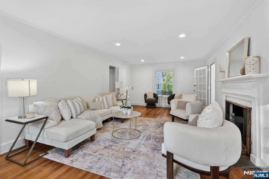 85 Whitney Road Short Hills, NJ 07078 - Photo 3 of 34 a living room with furniture and a fireplace