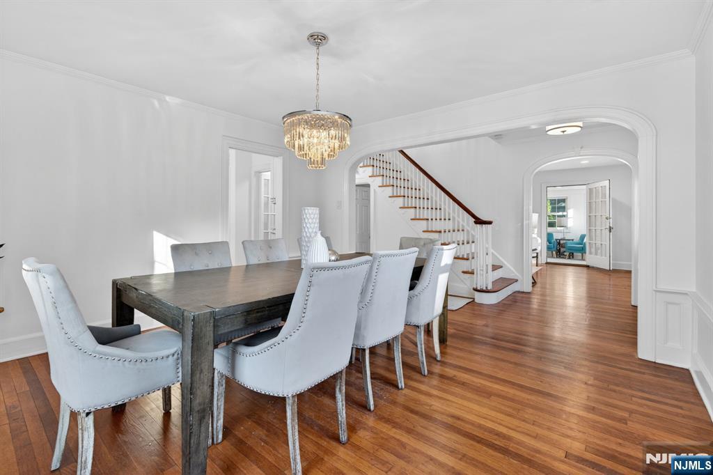 85 Whitney Road Short Hills, NJ 07078 - Photo 7 of 34 a view of a dining room with furniture wooden floor and chandelier