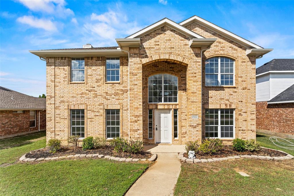 2922 Tree Line Road Garland, TX 75040 - Photo 1 of 1 a front view of a house with a yard