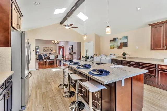 a view of a dining room with furniture and wooden floor