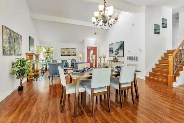 a bedroom with a bed and a potted plant