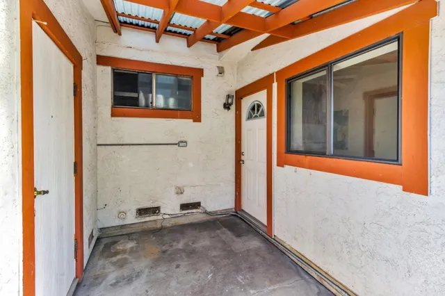 a kitchen with cabinets and window