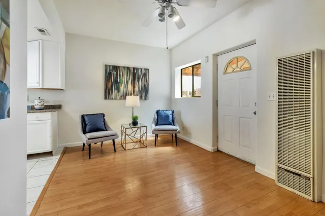 a kitchen with furniture a sink and white cabinets