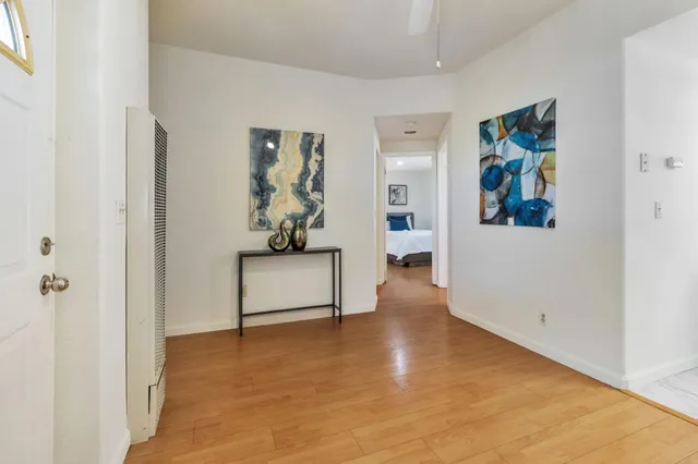 a patio with yard glass top table and chairs