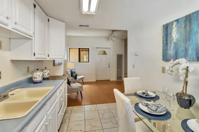 a view of a chairs and table in the patio