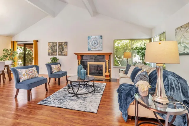 a living room with furniture or couch and a table