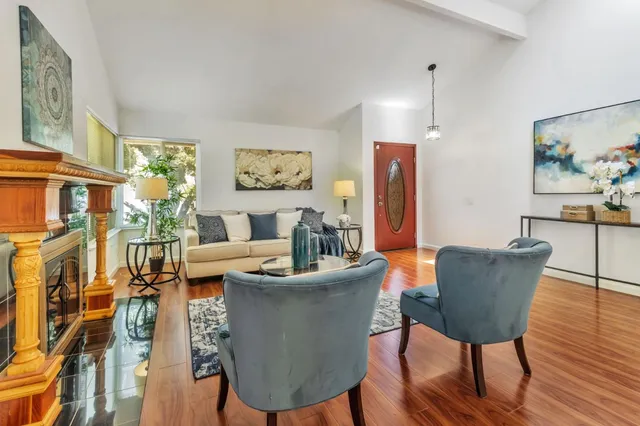 a kitchen with granite countertop cabinets stainless steel appliances and a counter space
