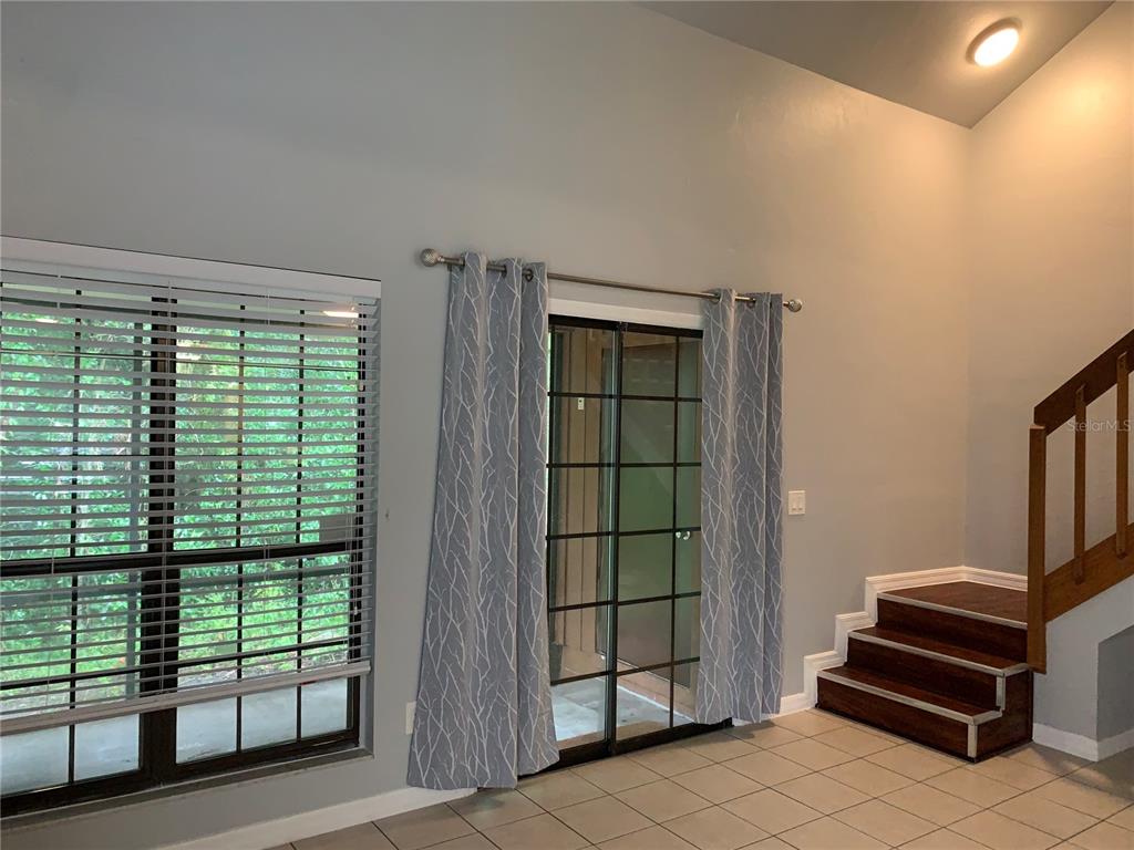 5754 Southwest 8th Place Gainesville, FL 32607 - Photo 11 of 29 a view of entryway and hall with wooden floor