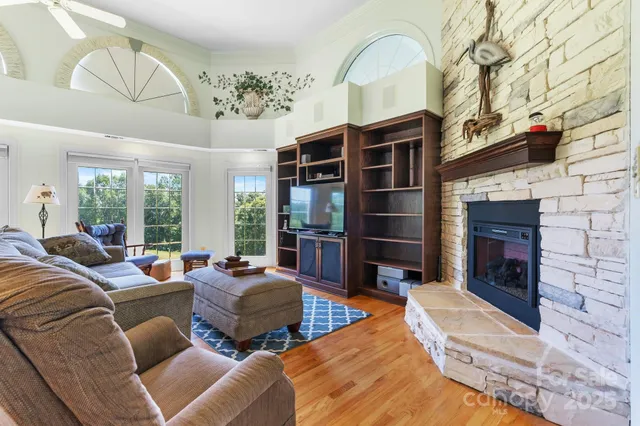 a living room with furniture windows and a fireplace