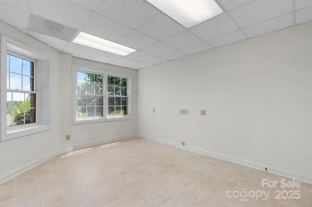 an empty room with windows