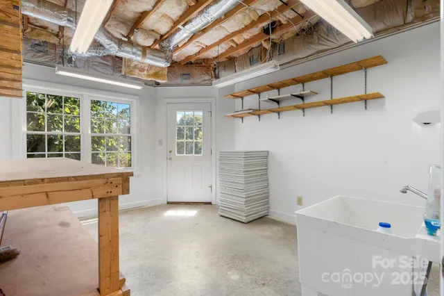 an aerial view of house with yard swimming pool and outdoor seating