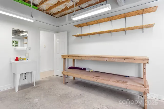 a view of a porch with a table and chairs
