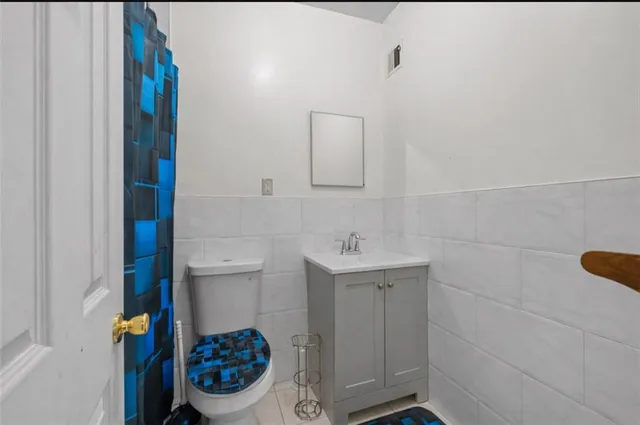 a bathroom with a toilet and a sink