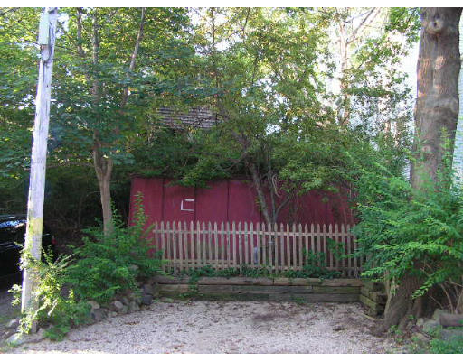 126 Front Street Marblehead, MA 01945 - Photo 12 of 14 a view of a house with a small yard and a large tree