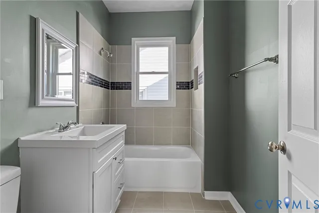 a bathroom with a sink toilet and tub